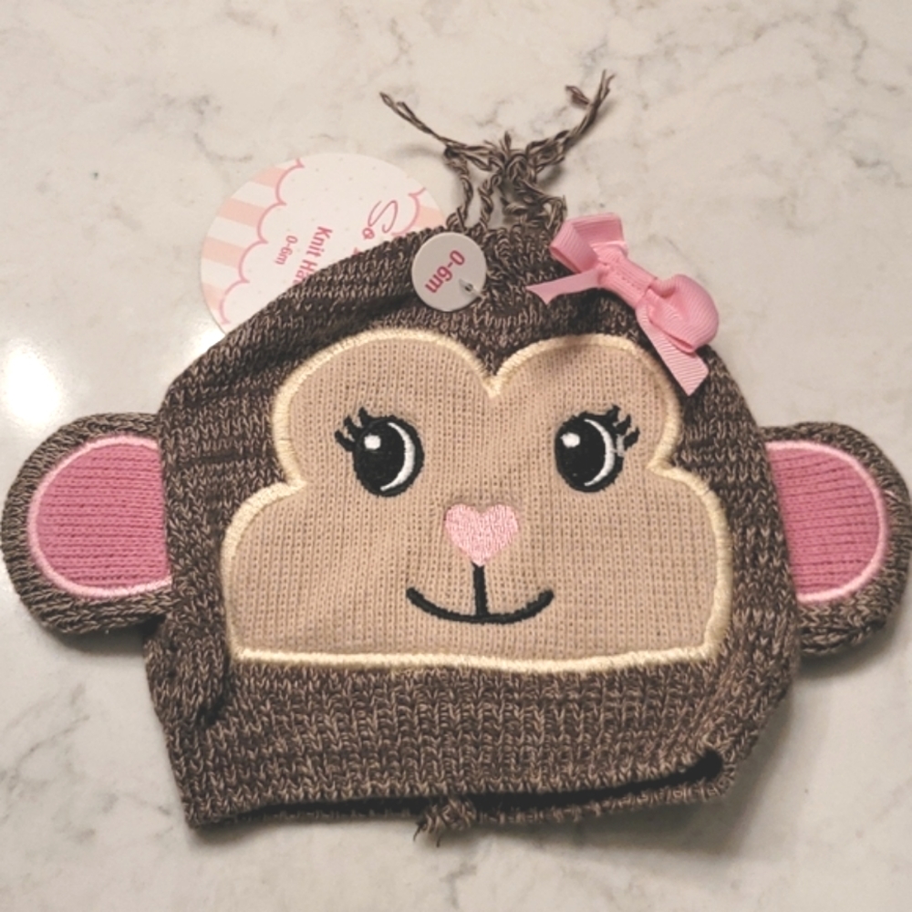 SO'DORABLE BABY MONKEY HAT. IT REALLY IS ADORABLE. SIZE 0-3M. BROWN PINK